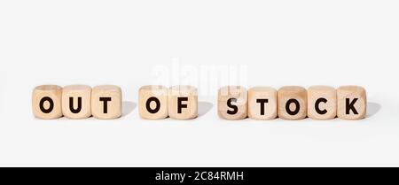 Out of stock concept. Sign in wooden blocks on white background. Copy space Stock Photo