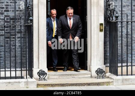 London, UK.  21 July 2020.  Mike Pompeo, US Secretary of State, exits Number 10 Downing Street, accompanied by Dominic Raab, Foreign Secretary, after talks with Boris Johnson, Prime Minister.  The agenda was expected to include the COVID-19 economic recovery plans, issues related to the People’s Republic of China (P.R.C.) and Hong Kong, and the U.S.-U.K. Free Trade Agreement negotiations. Credit: Stephen Chung / Alamy Live News Stock Photo