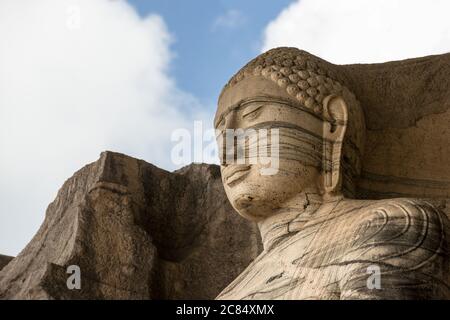The ancient capital city of Polonaruwa in North Eastern Sri Lanka is home to Gal Vihara, a rock temple famous for its four statues of the Buddha. Stock Photo
