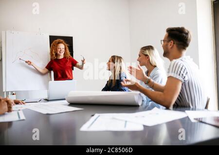 Creative brainstorming. Happy business people, designers, architects working as a team in office Stock Photo