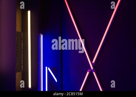 Background of an empty room with brick walls and neon lights, laser lines Stock Photo