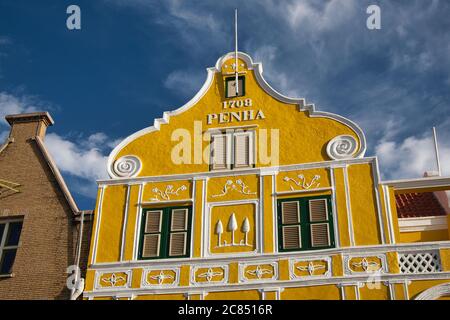 Looking up at a typical Dutch colonial style building in Willemstad, dated on the front as built 1708, Curacao, The West Indies, Caribbean Stock Photo