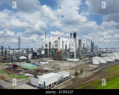 industrial area dominated by chimneys and smoke of the oil refinery, Rotterdam Stock Photo