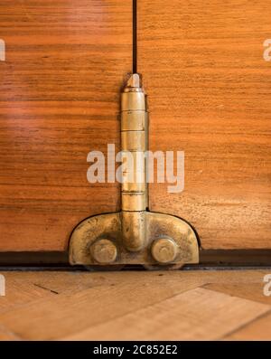 Detail of brass hinge. Hackney Town Hall, London, United Kingdom. Architect: Hawkins Brown Architects LLP, 2017. Stock Photo