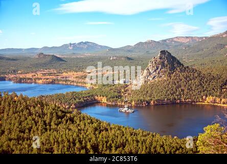 Majestic nature of Kazakhstan concept: epic view of Burabay lake with Zhumbaktas rock at sunrise in autumn season Stock Photo