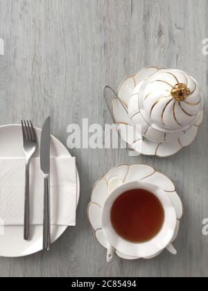 Top down view of a tea drinking setting with white porcelain ware Stock Photo