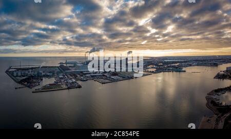 Copenhagen Denmark - December 23 2018: Aerial picture of Refshaleøen, near Copenhagen, Denmark, showing industrial buildings, moody sky full of clouds Stock Photo