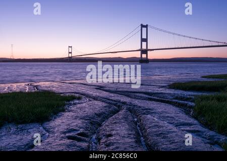 The Severn Bridge across the River Severn between England and Wales at Aust, Gloucestershire, England.
