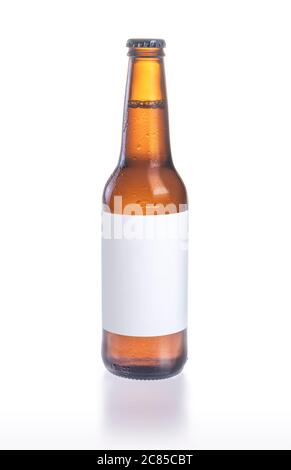 Beer bottle, blank label on white background, simple brown beer bottle with condensation drops isolated on white background with blank label Stock Photo