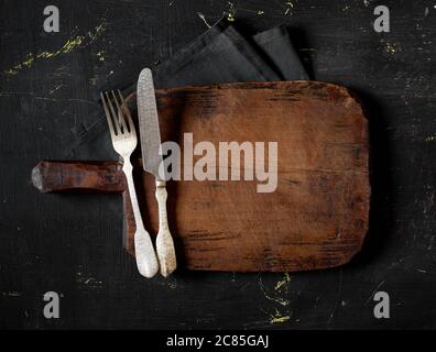 Fork, knife and cutting board Stock Photo