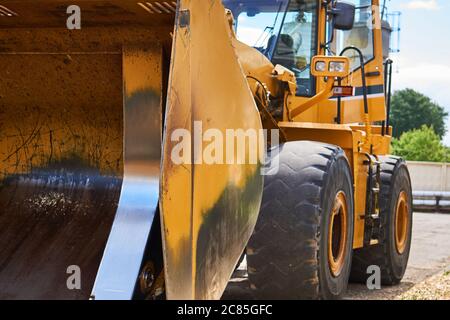 standing heavy construction wheeled bulldozer close up Stock Photo