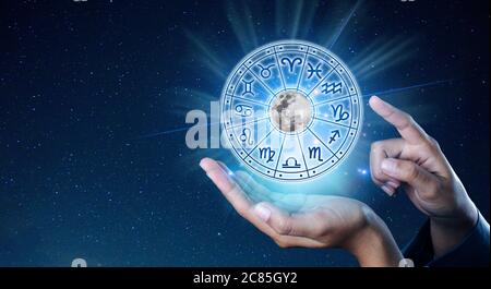 Zodiac signs inside of horoscope circle. Astrology in the sky with many stars and moons  astrology and horoscopes concept Stock Photo