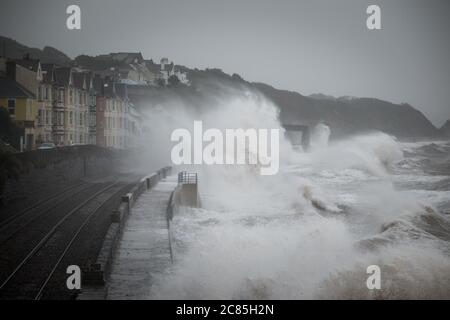 Storm Callum causes huge waves to crash across trains as they travel along the seafront at Dawlish, Devon, UK. Stock Photo