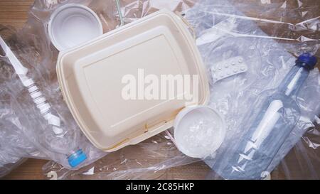 household plastic waste including bottles bags containers and packaging material Stock Photo