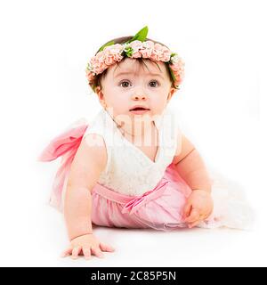 Square lifestyle portrait of a baby girl on her 1st birthday. Stock Photo