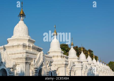 White stupas of Kuthodaw Pagoda in Mandalay, Burma Myanmar Stock Photo