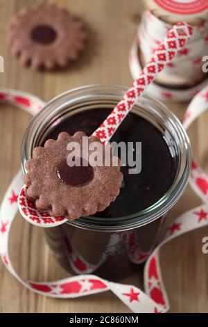 christmas chocolate biscuits spitzbuben on wooden table Stock Photo