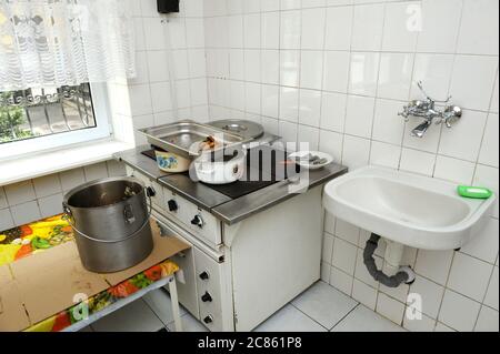 Stove Sink Cooking Utensils Countertop Stove Pots Pans White Wall