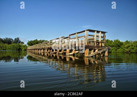 Fishing pier on Coral Creek near the Intercoastal Waterway in Placida, Florida Stock Photo