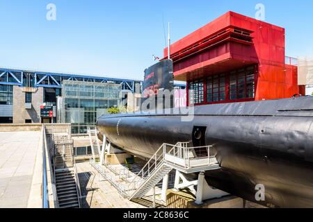 General view of the Argonaute submarine, converted to a museum ship in the parc de la Villette in front of the Cite des Sciences in Paris, France. Stock Photo