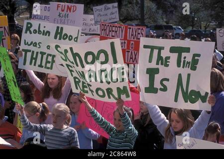 Austin Texas USA, February 17 2003: Students and parents decry impending public school budget cuts during a rally at the Texas Capitol. ©Bob Daemmrich Stock Photo