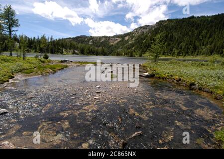 Banff National Park, Alberta Canada, August 2005: Grizzly Creek and Grizzly Lake on the Continental Divide near the Sunshine Village ski area in western Alberta. ©Bob Daemmrich Stock Photo