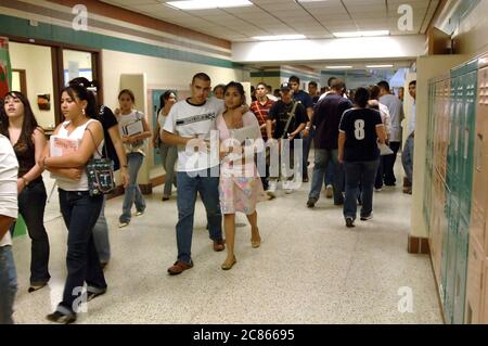 Brownsville, Texas USA, December 2, 2005: Students walking in school hallway between classes at Lopez High School, where the student population is more than 99% Hispanic. ©Bob Daemmrich Stock Photo