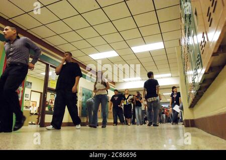 Brownsville, Texas USA, December 2, 2005: Students walking in school hallway between classes at Lopez High School, where the student population is more than 99% Hispanic. ©Bob Daemmrich Stock Photo