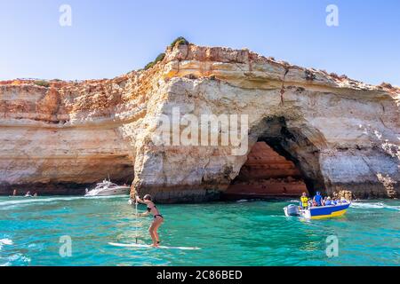 Boat Benagil Caves Tours. The most beautiful caves to visit in Algarve kayak cave boat trip,  sightseeing tours through the Benagil Caves on the Algar Stock Photo