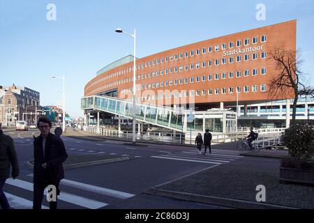 Town hall, municipal office or Stadskantoor in the center of Alkmaar. Modern building with a passage of traffic under the building. Holland, February Stock Photo