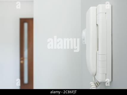 Home Intercom System Wired Talking Device on a Wall. Residential Communication Systems. Modern Technologies. Stock Photo
