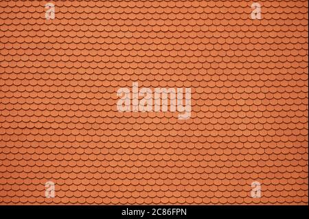 Orange Ceramic Roof Tiles Background. Tile Pattern. Architectural Roofing Material. Stock Photo