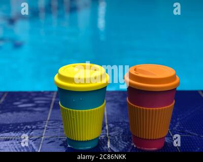 reusable bamboo mug at the swimming pool Stock Photo