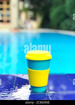 reusable bamboo mug at the swimming pool Stock Photo