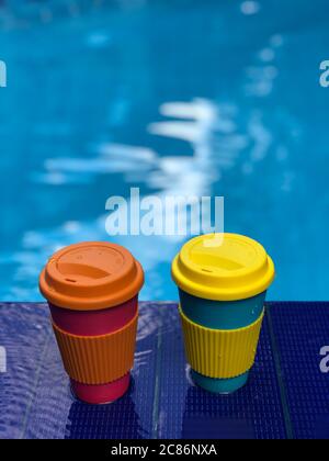 reusable bamboo mug at the swimming pool Stock Photo