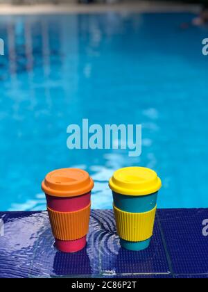 reusable bamboo mug at the swimming pool Stock Photo