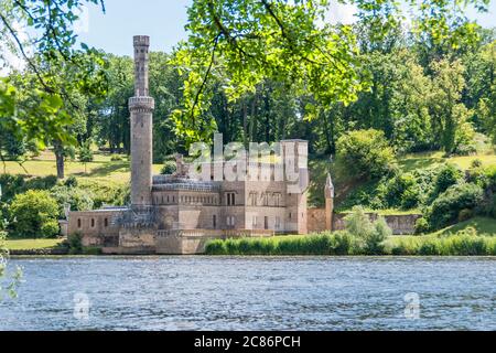 Babelsberg Park on the Tiefen See lake on the River Havel with the Steam-powered pump house in Potsdam, Germany Stock Photo