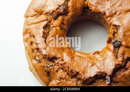 Freshly made spiced fruit ring loaf cake  on the white  background,  traditional British cake Stock Photo