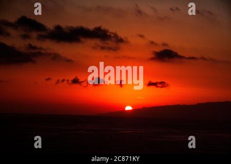 The sun setting over the Atlantic ocean from the island of tenerife Stock Photo