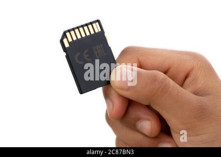 SD Card holds in hand isolated on white background Stock Photo