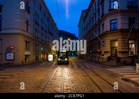 The metro, tram at a station stop. An eerie look around midnight during the summer solstice. In Helsinki, Finland. Stock Photo