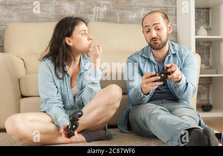 Couple having an argue after losing at online video games Stock Photo