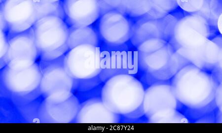 Blue bokeh light backgrounds. Blurred defocused dots. Abstract blurred reflection lighting. Bokeh with festive light background. Stock Photo