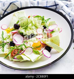 Chilaquiles (in Mexican cooking) a dish of fried tortilla strips  with a eggs and cheese. Mexican food. Mexican breakfast. Stock Photo