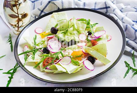 Chilaquiles (in Mexican cooking) a dish of fried tortilla strips  with a eggs and cheese. Mexican food. Mexican breakfast. Stock Photo