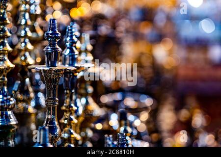 hookahs bowls at showcase in souvenir shop, on blurred background Stock Photo