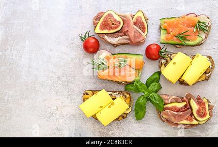 Assortment of homemade toast sandwich with salmon, ham, and cheese Stock Photo