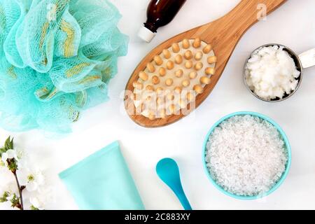 Spa and Wellness - Bath brush, Sea salt and coconut oil. Ingredients for Cellulite Massage. Flat lay.
