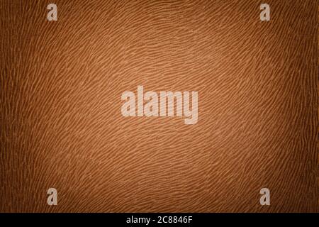 Dark brown matte background of suede fabric, closeup. Velvet texture of seamless orange leather. Felt material macro with pattern of animal wool and v Stock Photo