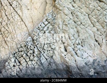 Full frame textured surface of the rock as a backdrop.  Stock Photo
